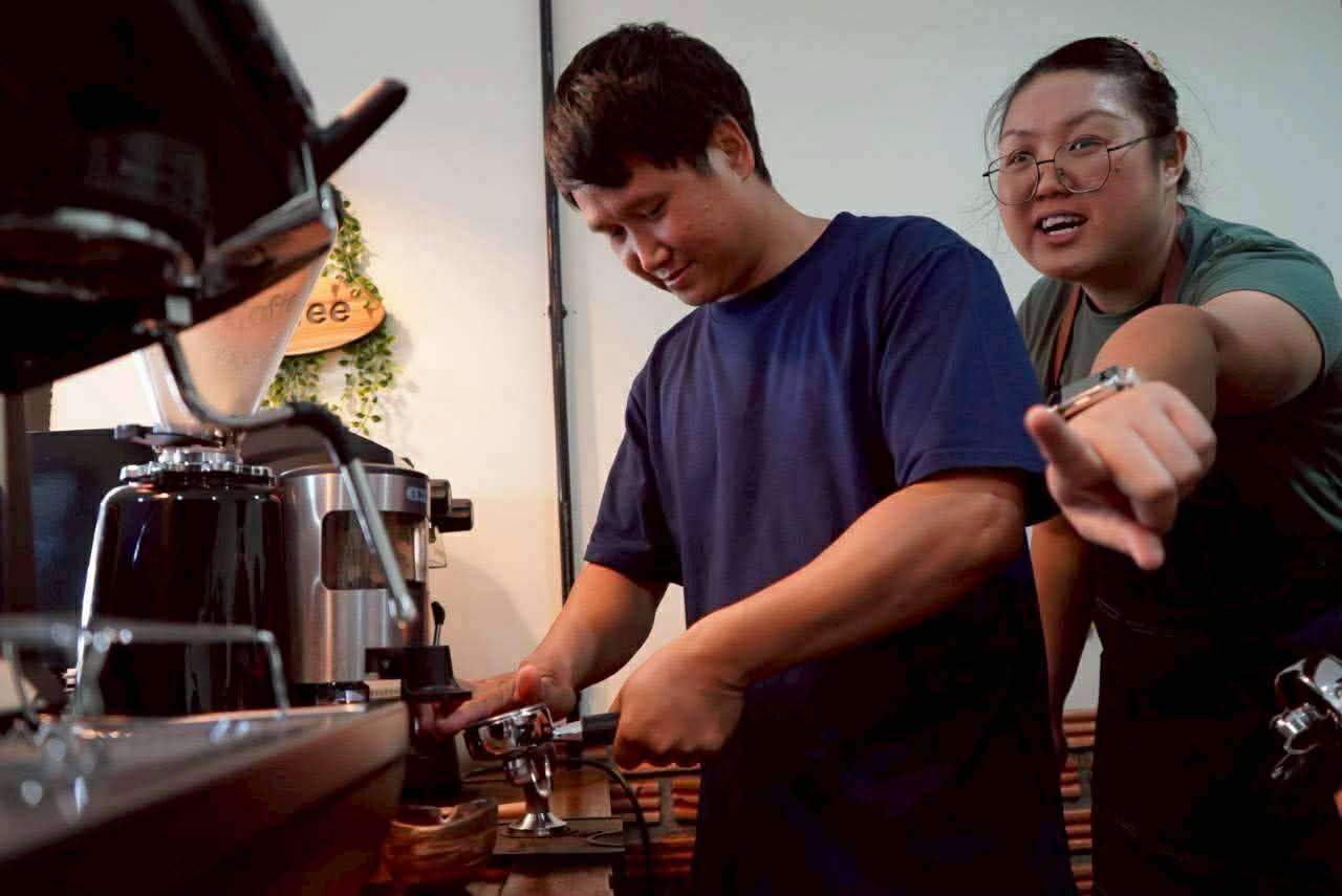 The youth learned how to use the drink making equipment.