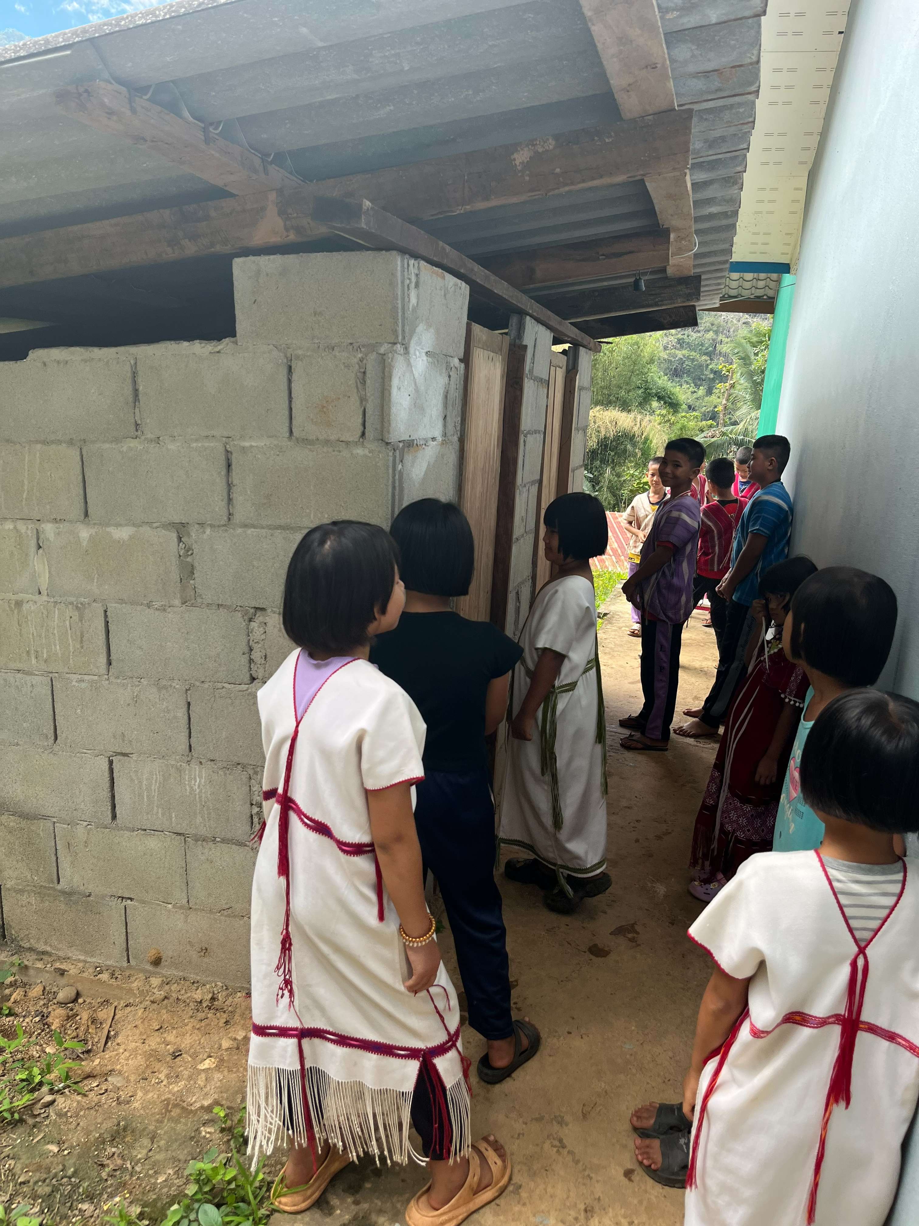 Children are lining up to go to the restroom.