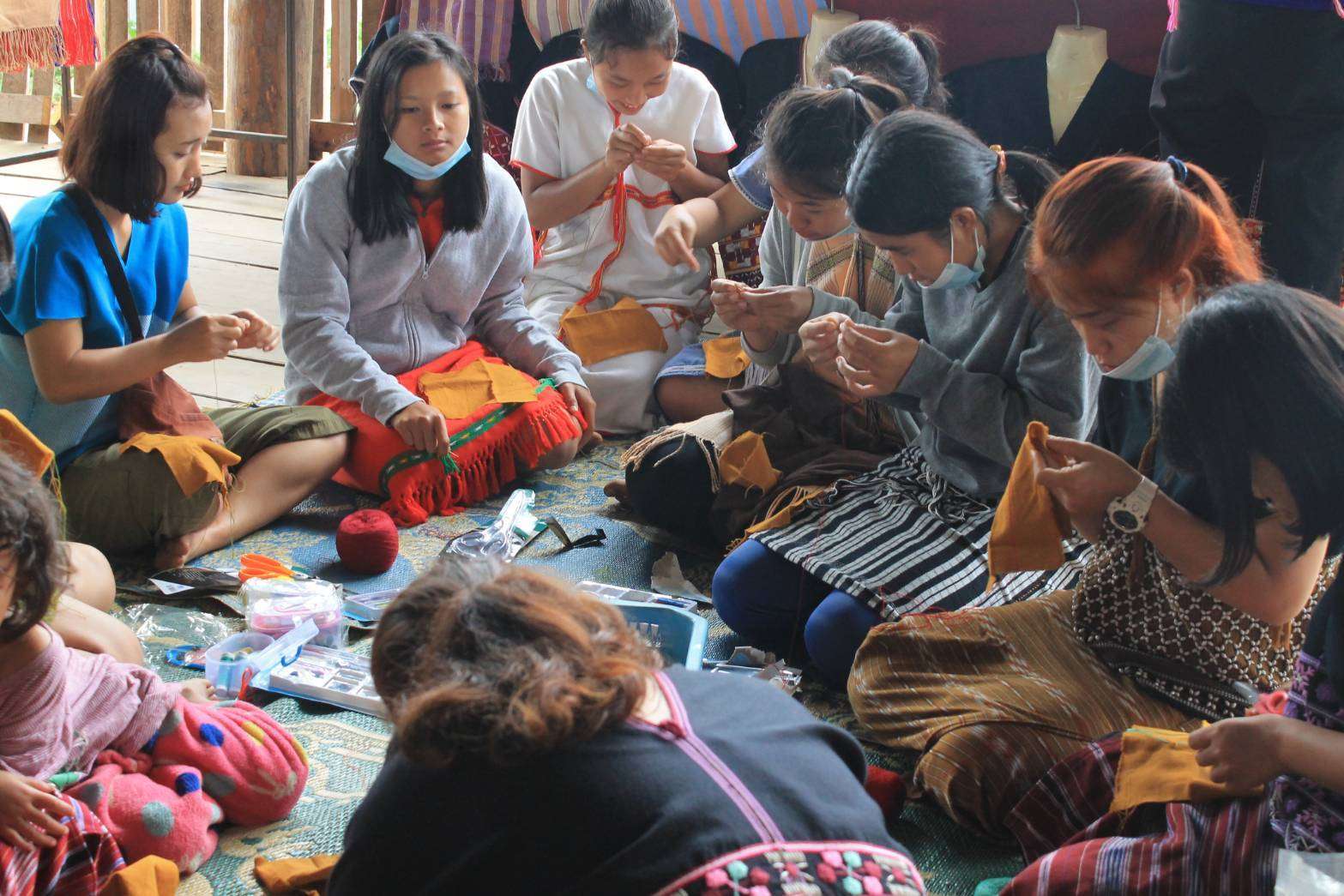 Children and youth learn to embroider.