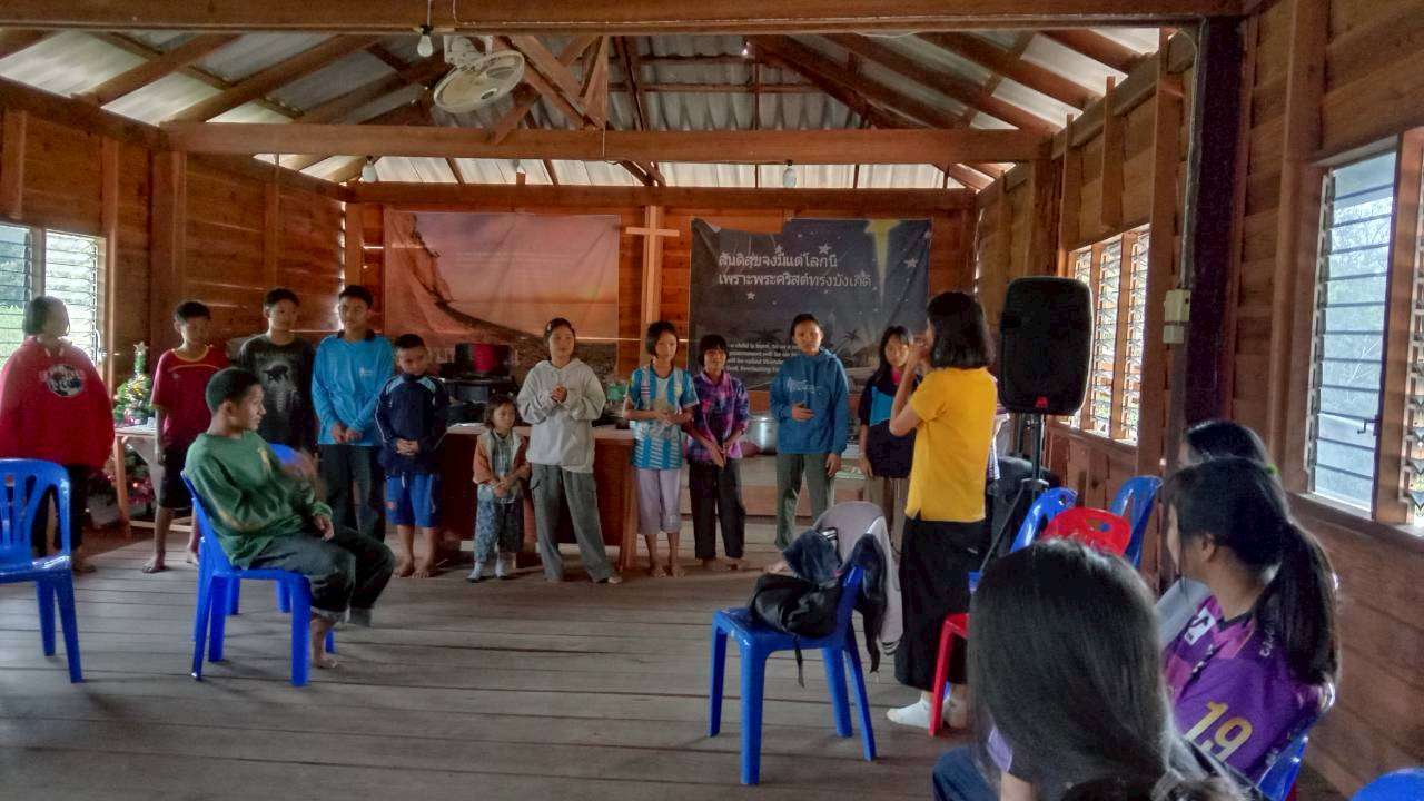 Children enjoying playing games together after a meal.