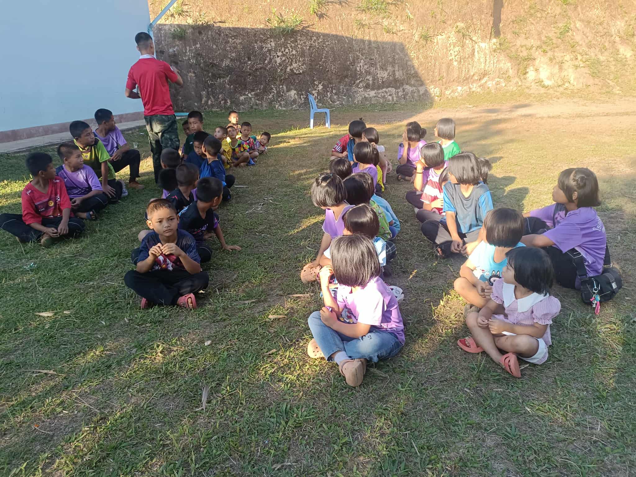Learning under the sun! ☀️ A group of children enjoying their Sunday school lessons outside on a beautiful day!"