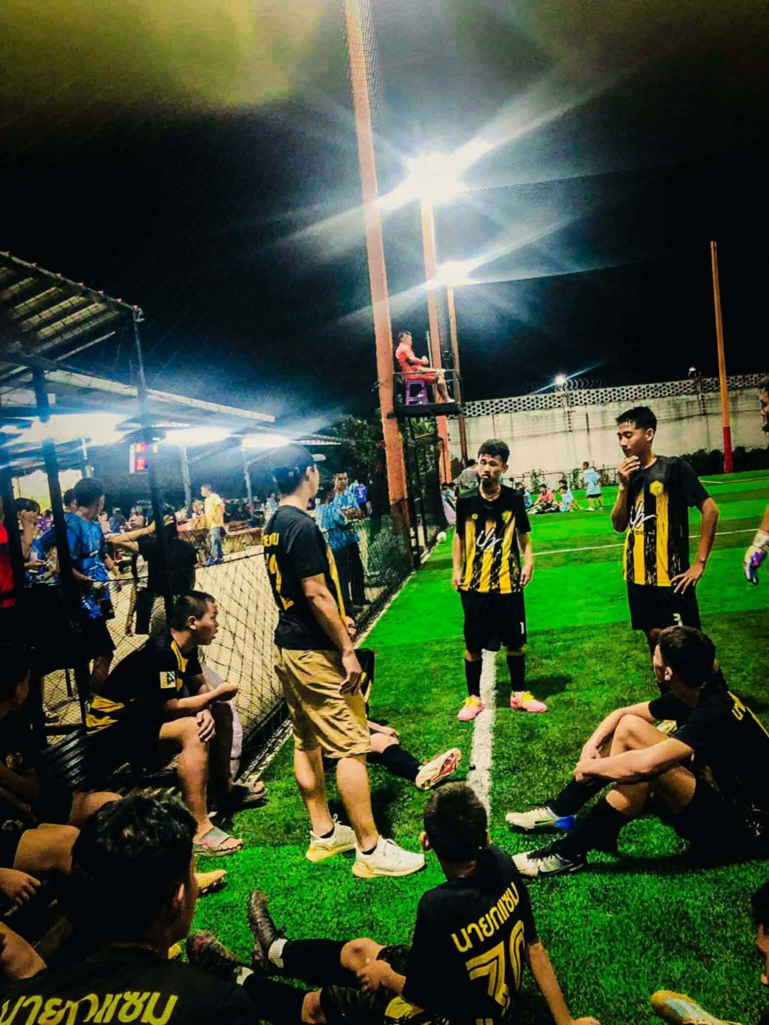 The alumni coach led the younger students in the competition.