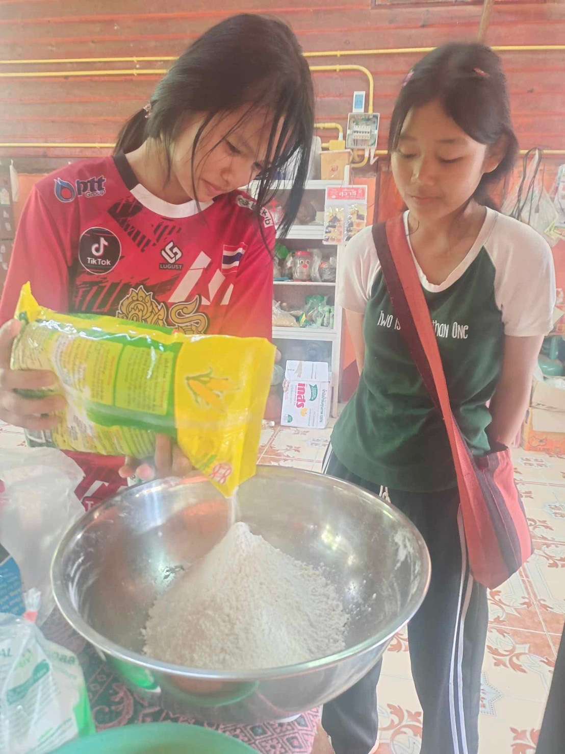 Children are preparing dough for making pastries.
