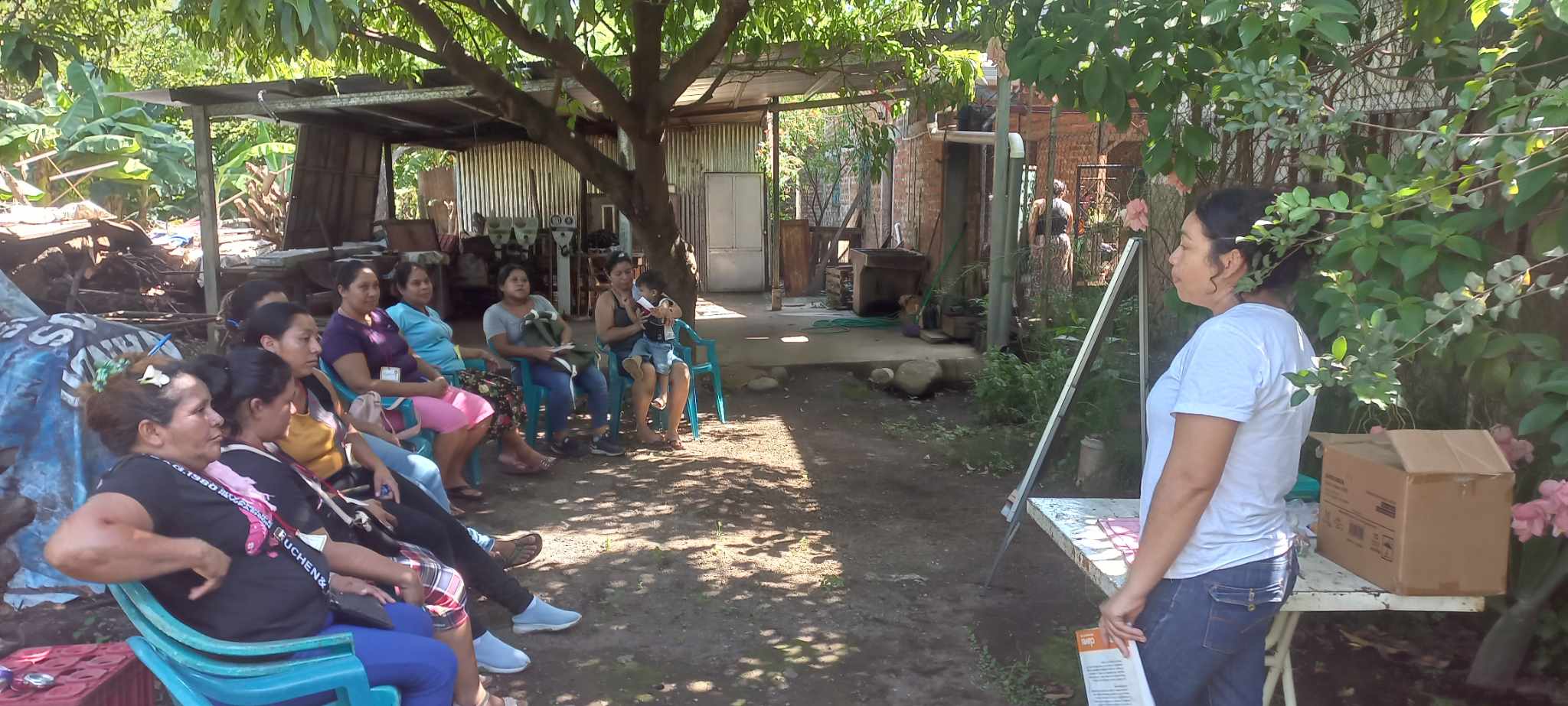 Protection workshop with mothers outside the temple