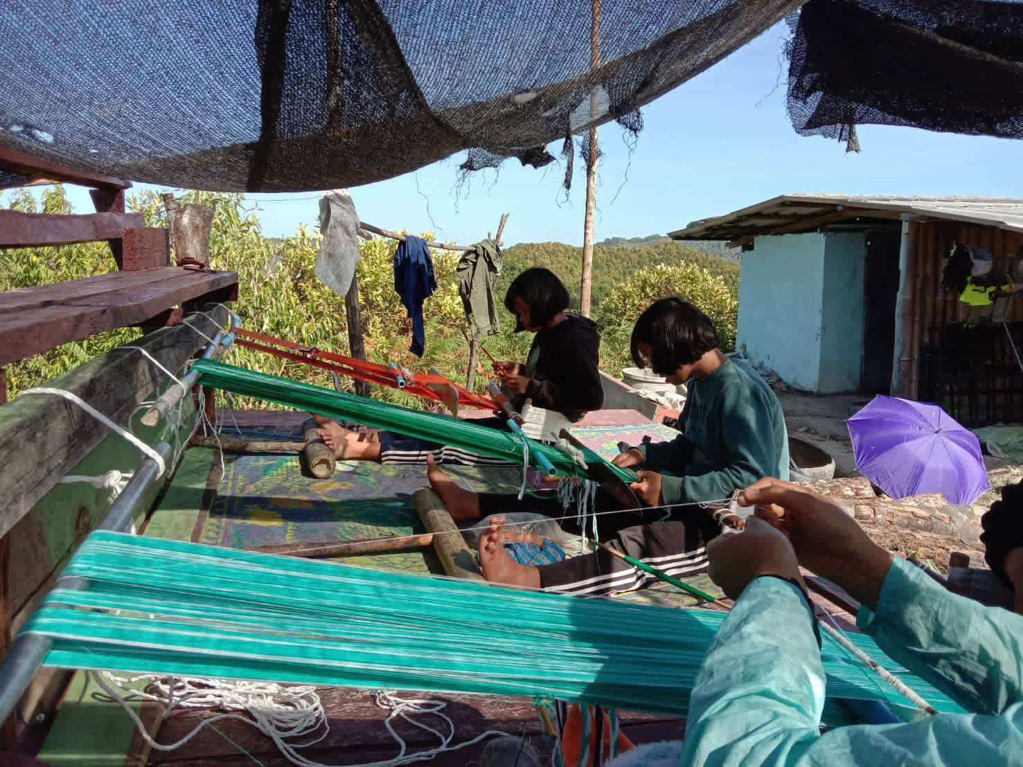 Honoring Tradition: A Girl Greeted by a Local Weaver—Building Bridges for Future Skills