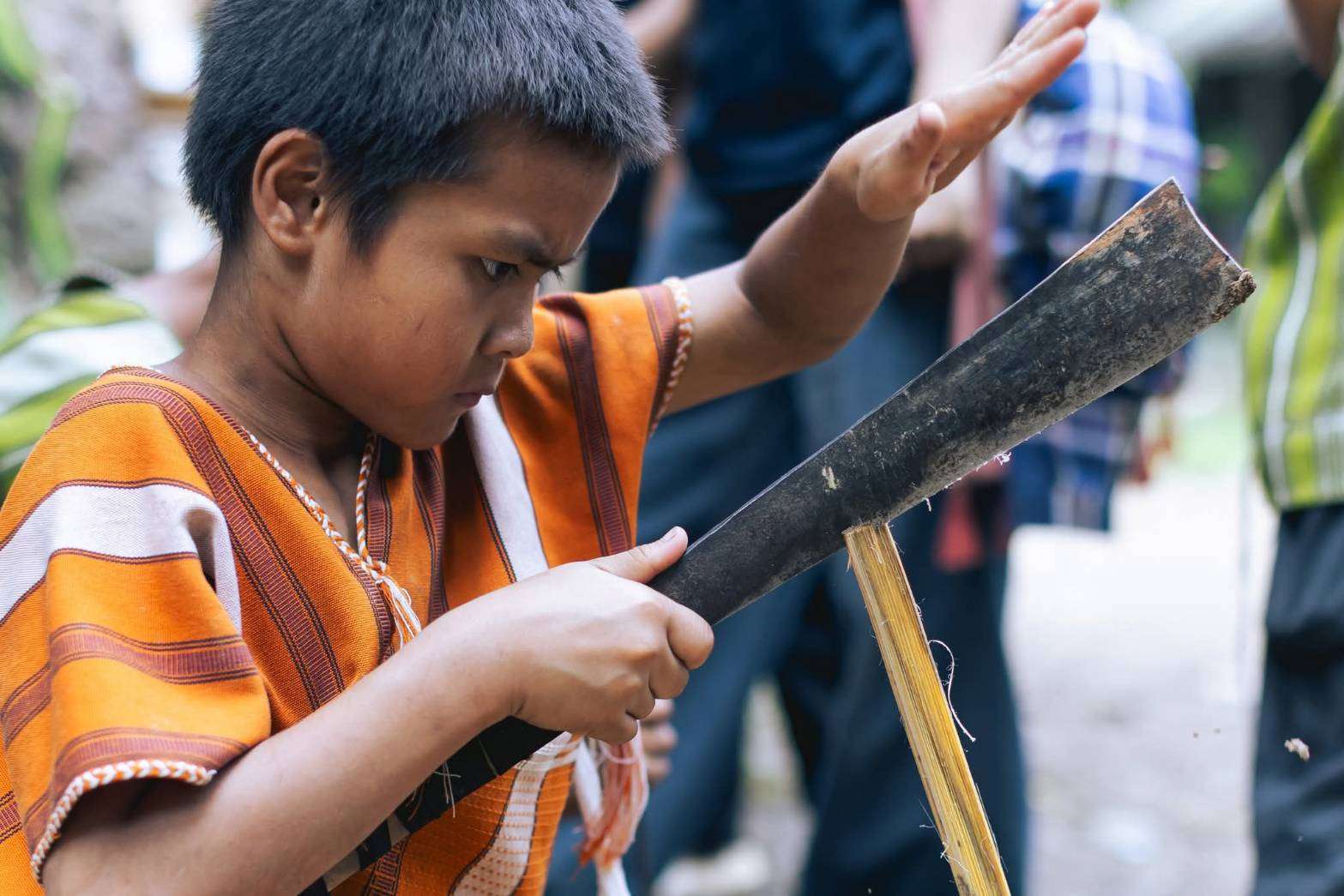 Splitting bamboo to make crafts.