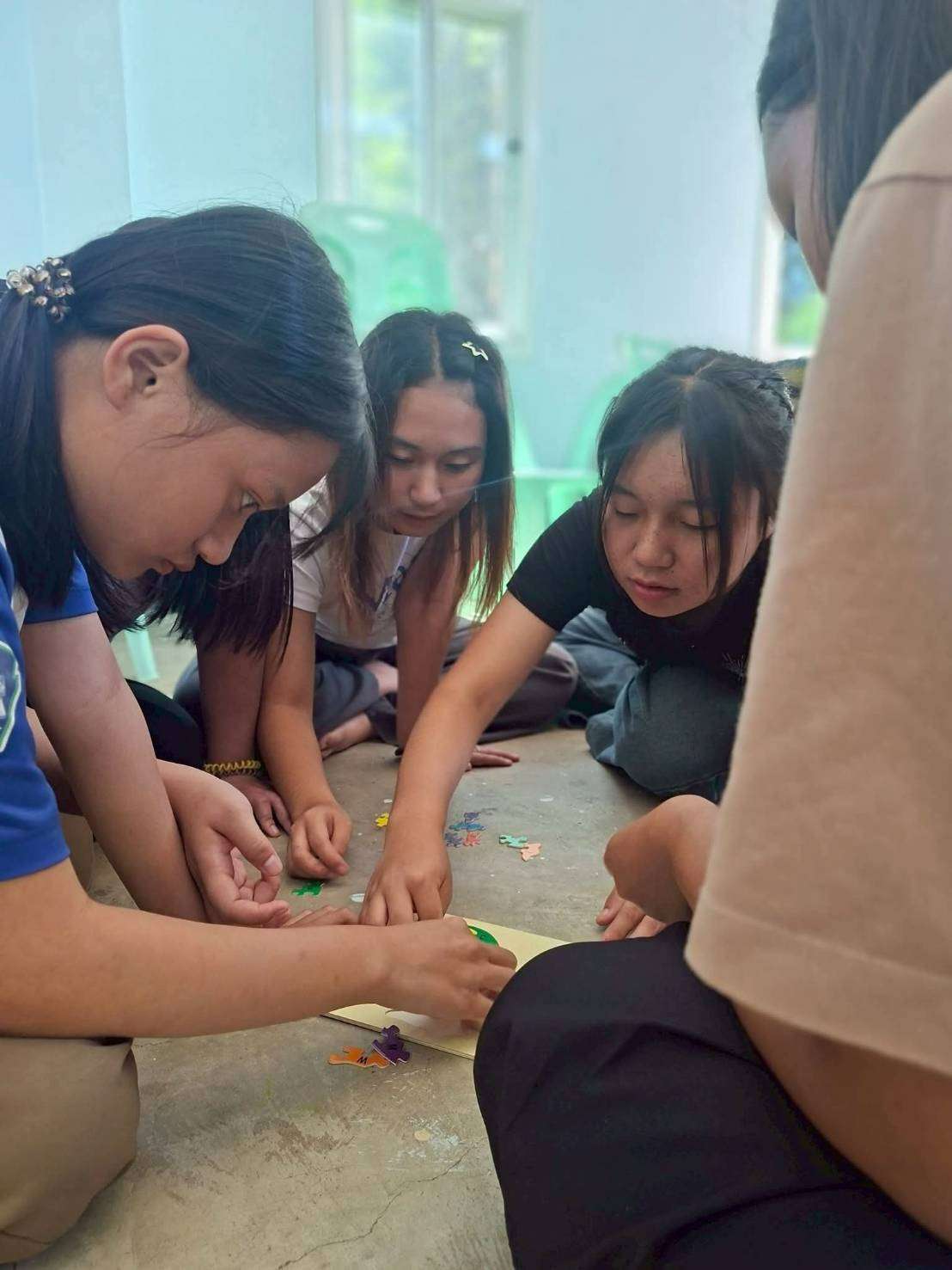 Youth work together to analyze community problems.