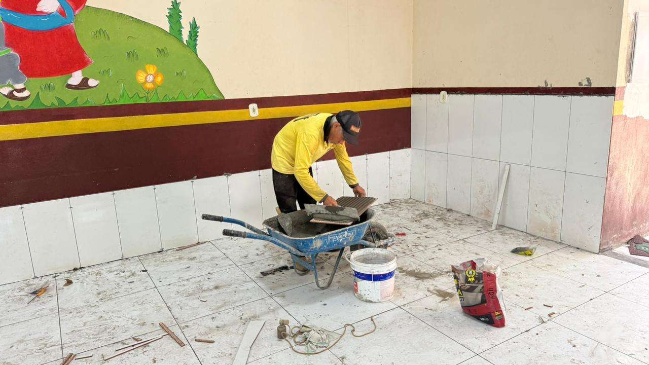 Application of ceramic tiles on walls and floors.