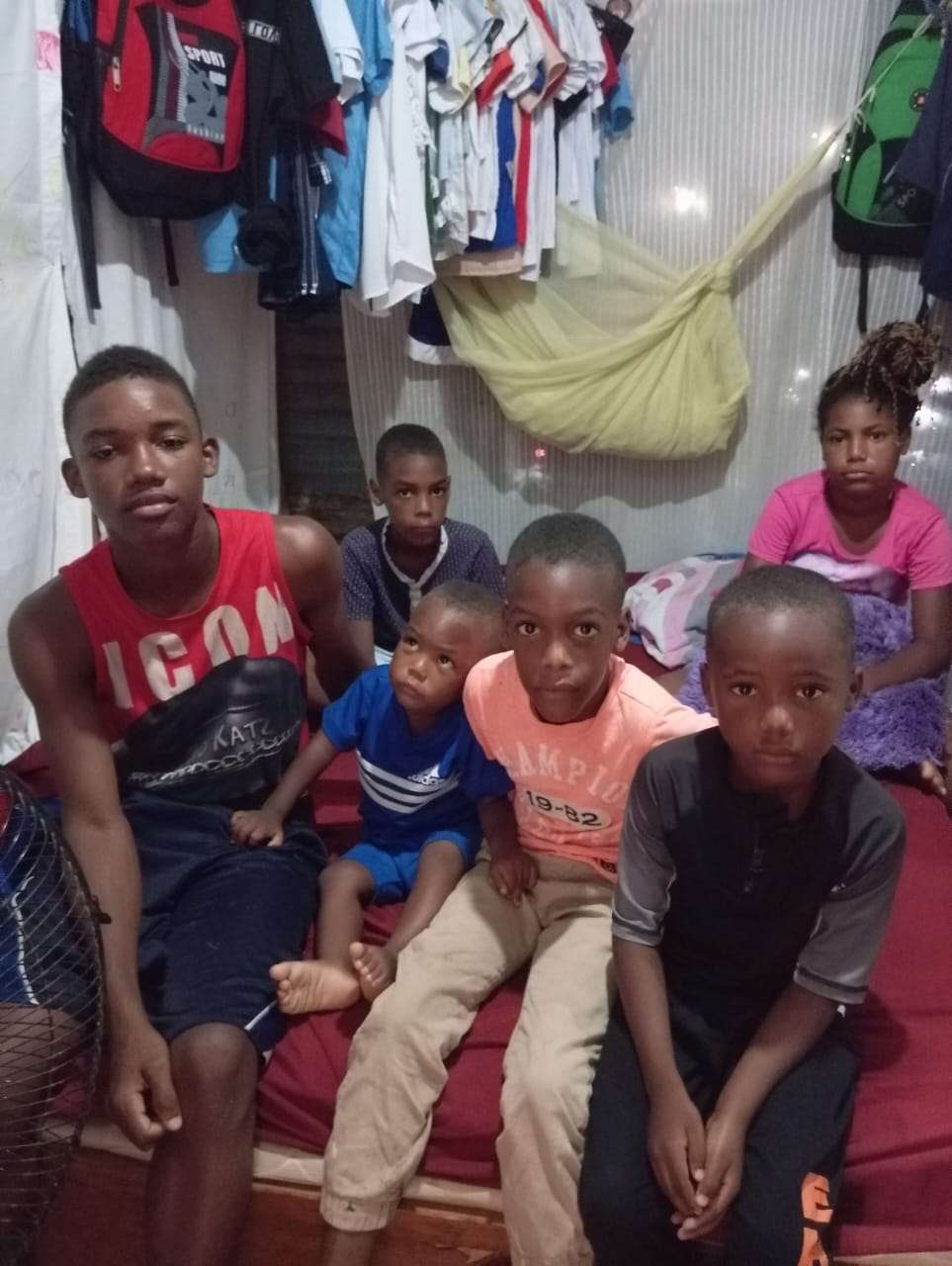 The five children share this single bed.