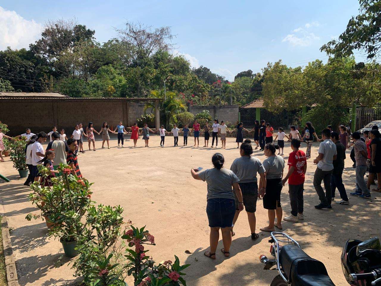 Children and young people doing activities in the parking lot.