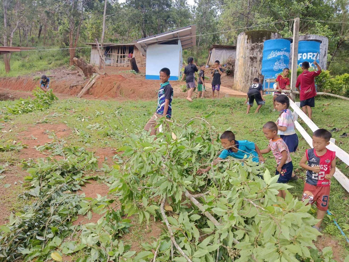 The children helped clean up the side of the field.