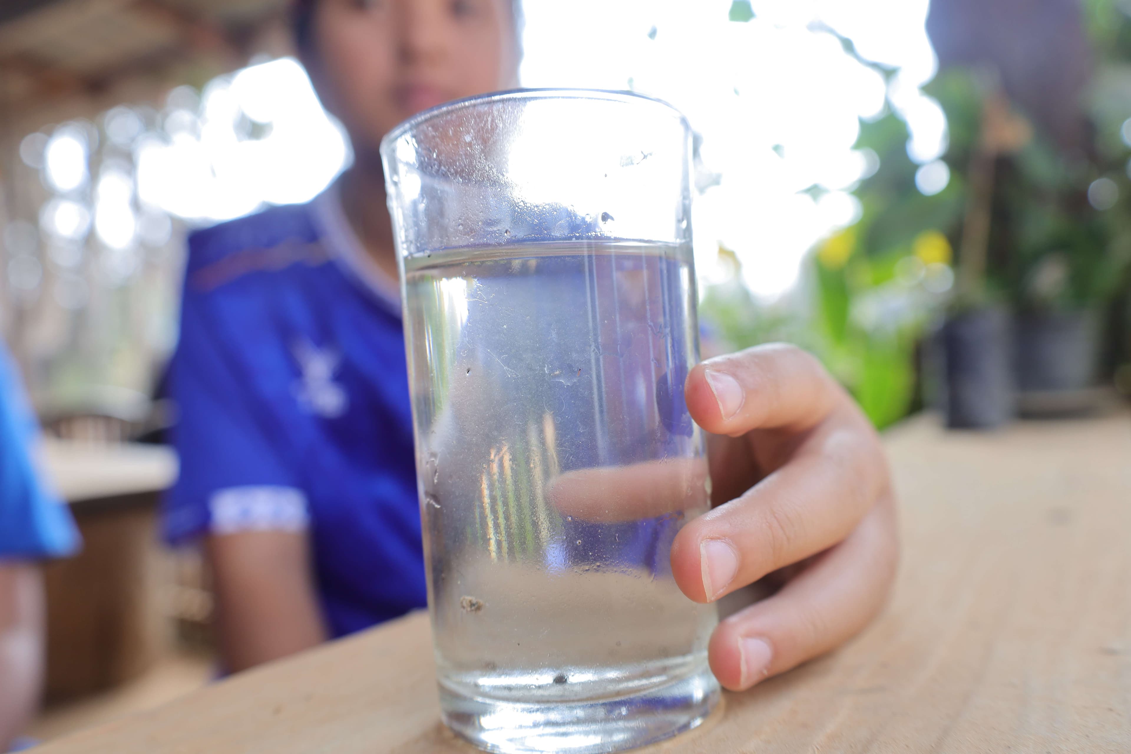 The water the children drank is cloudy and unclean.