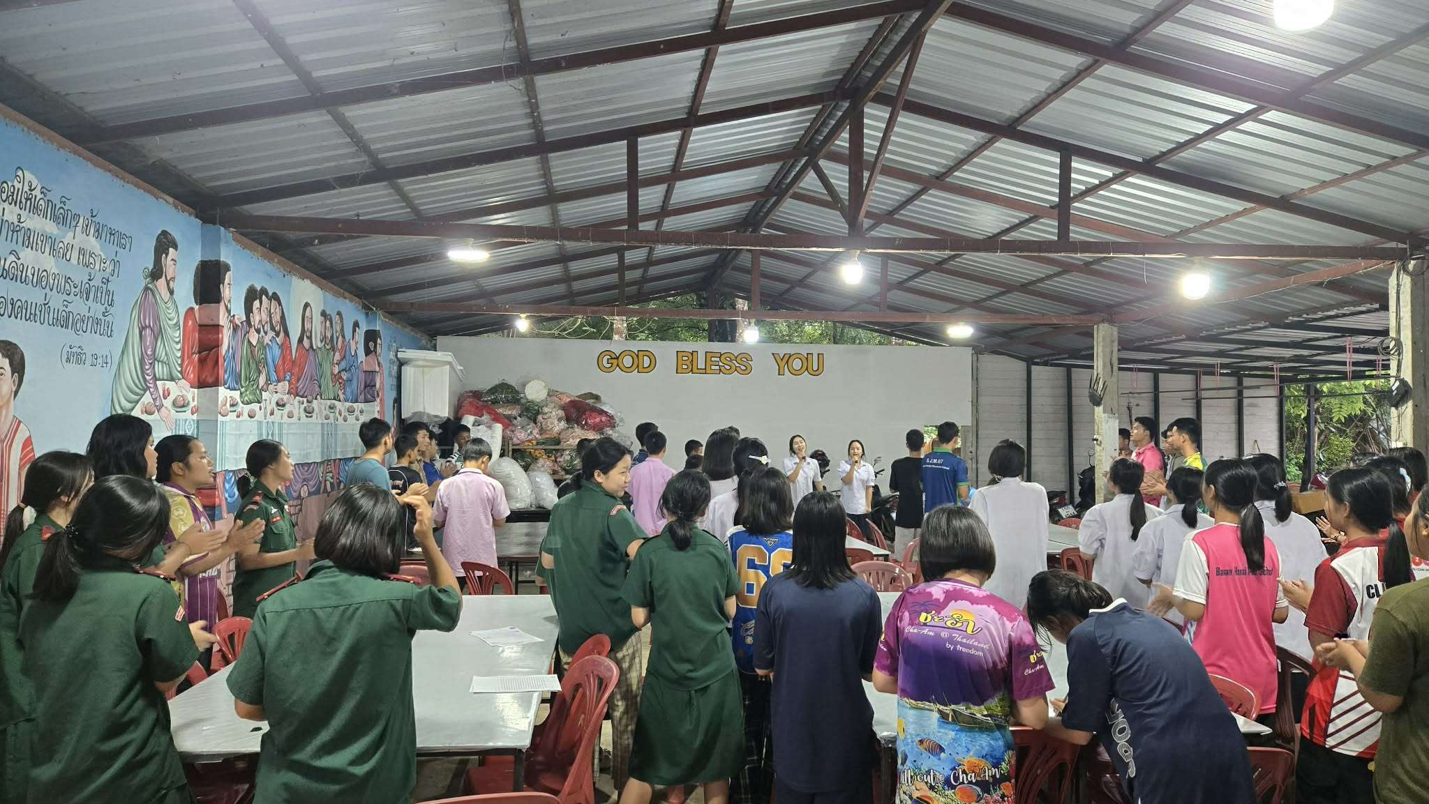 Singing songs of praise to God in the evening.