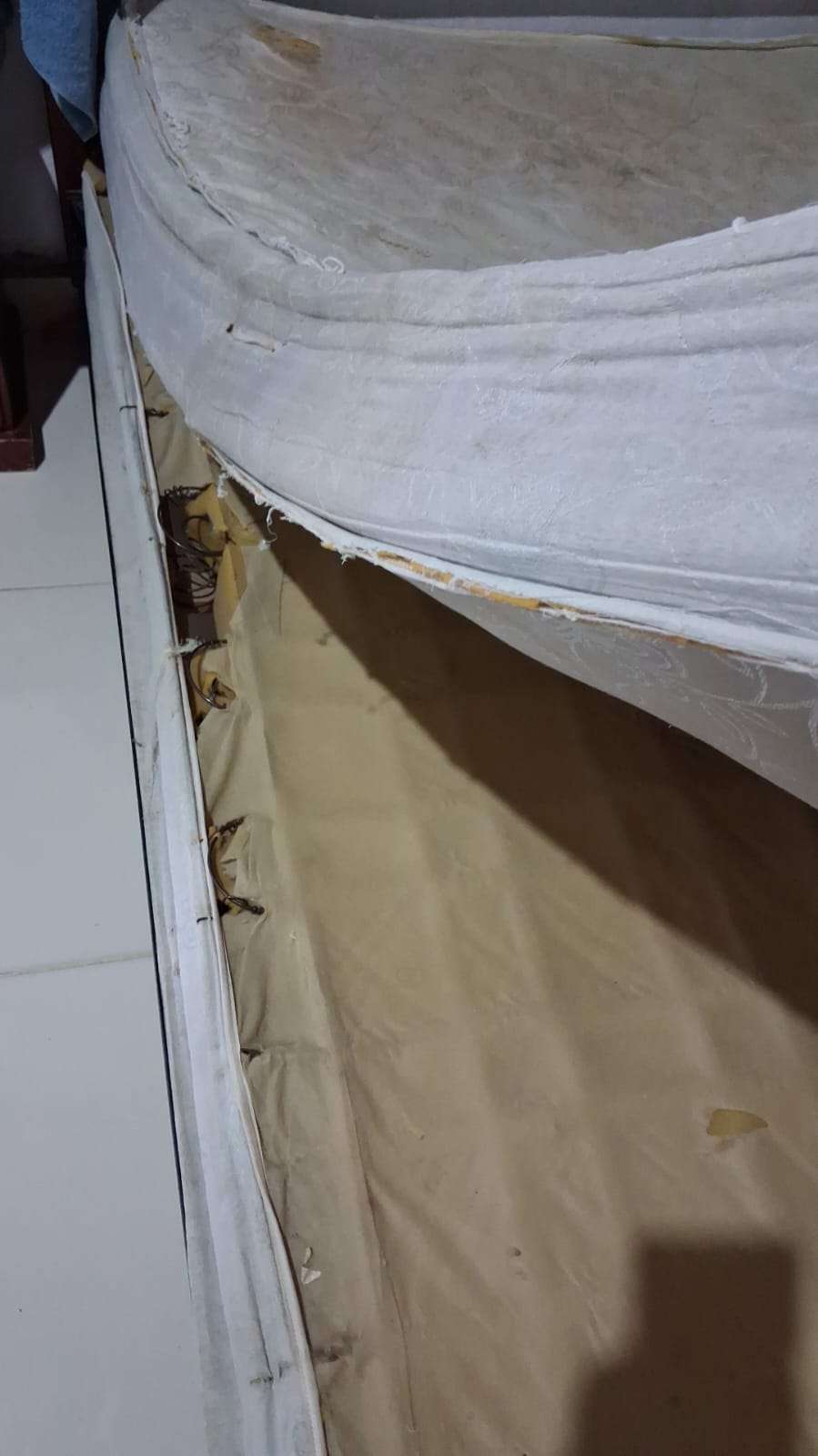 participant's bed with unsafe base and mattress