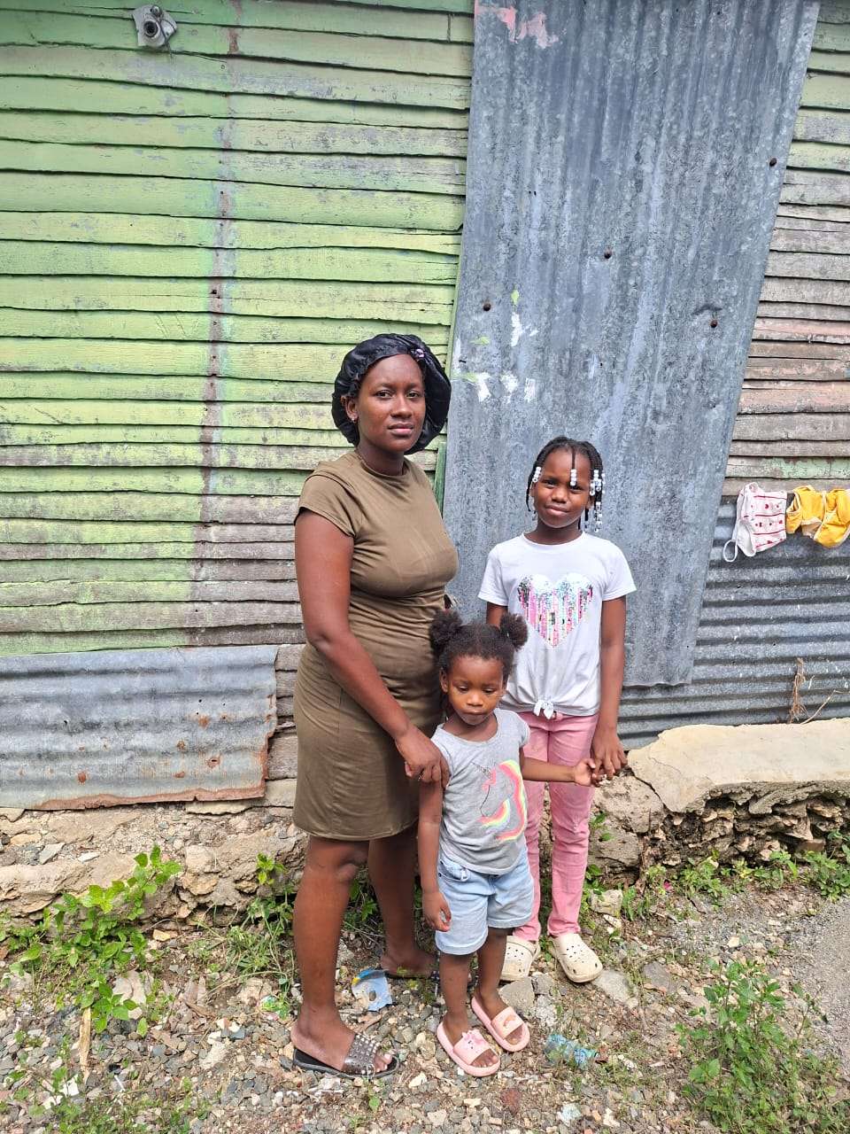 Yasmin and two of her daughters, the eldest is on scholarship