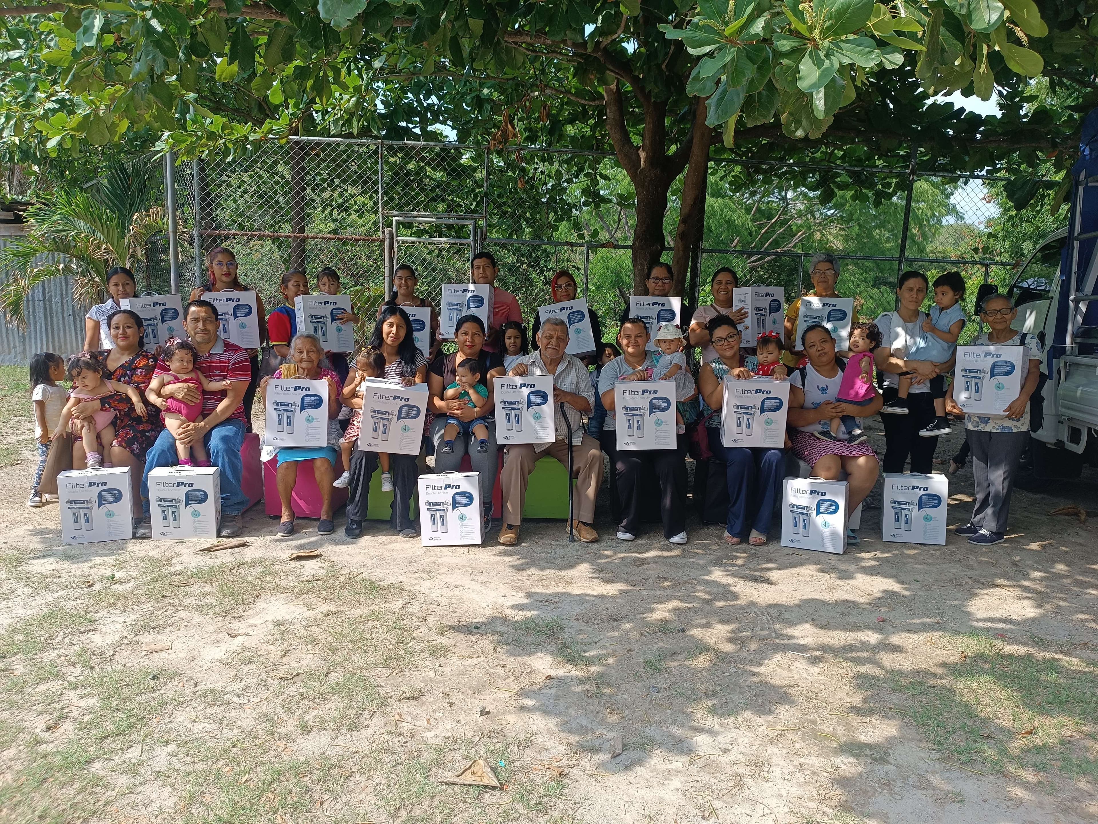Beneficiary families receiving their filters.