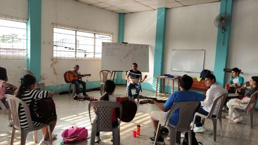 Guitar lessons for 8 young people at the church