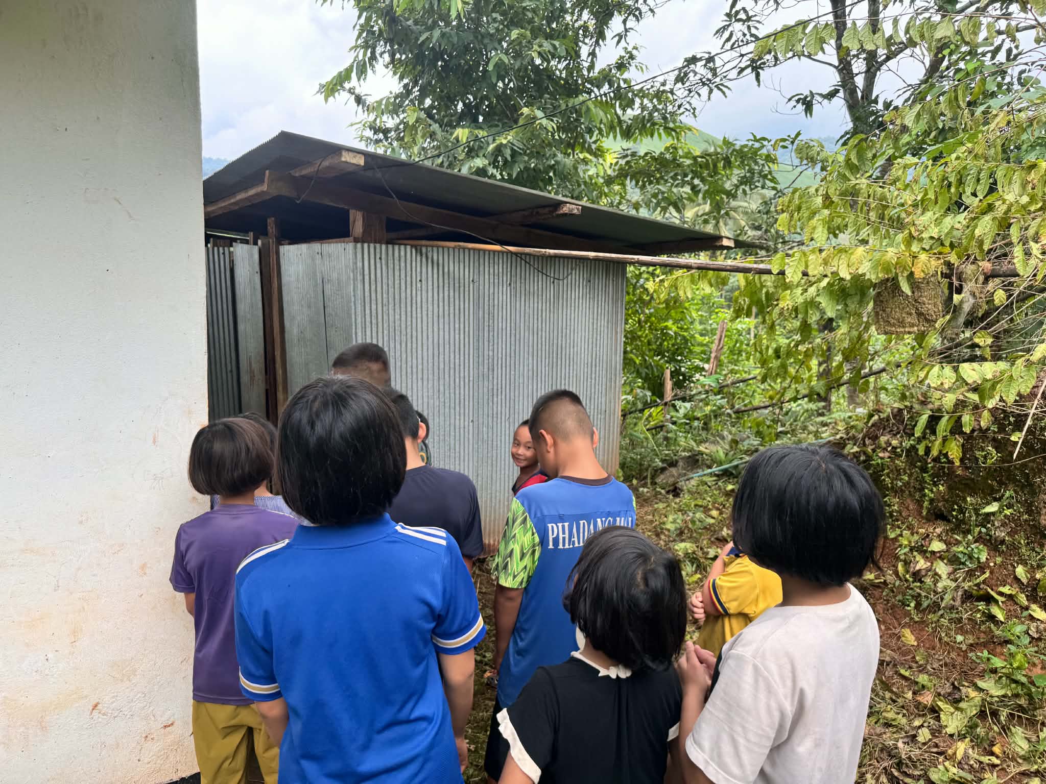 Due to the limited number of restroom facilities, children often have to wait in long lines to use the toilets.