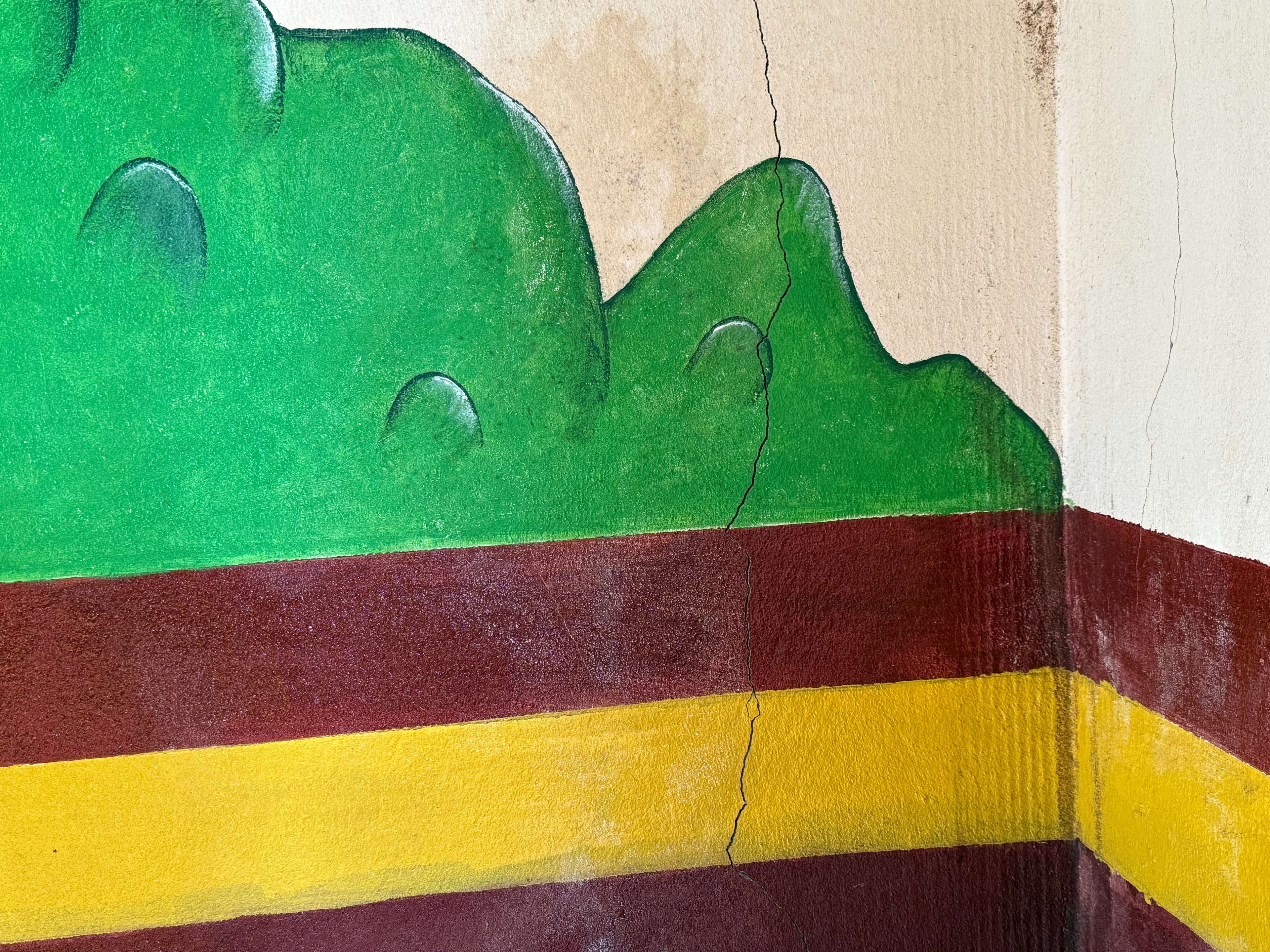 The cafeteria wall has cracks.