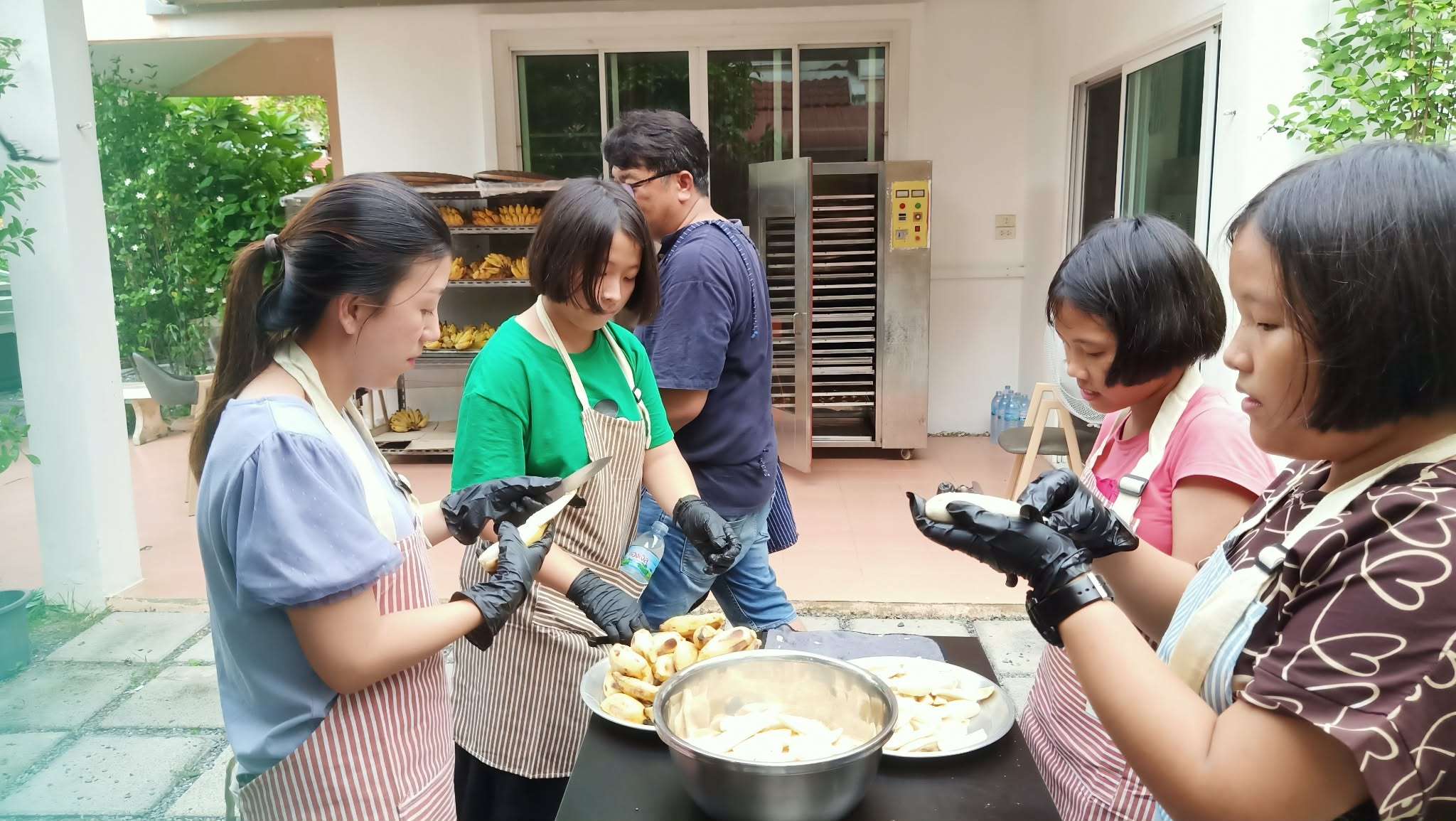 Selecting and slicing bananas.