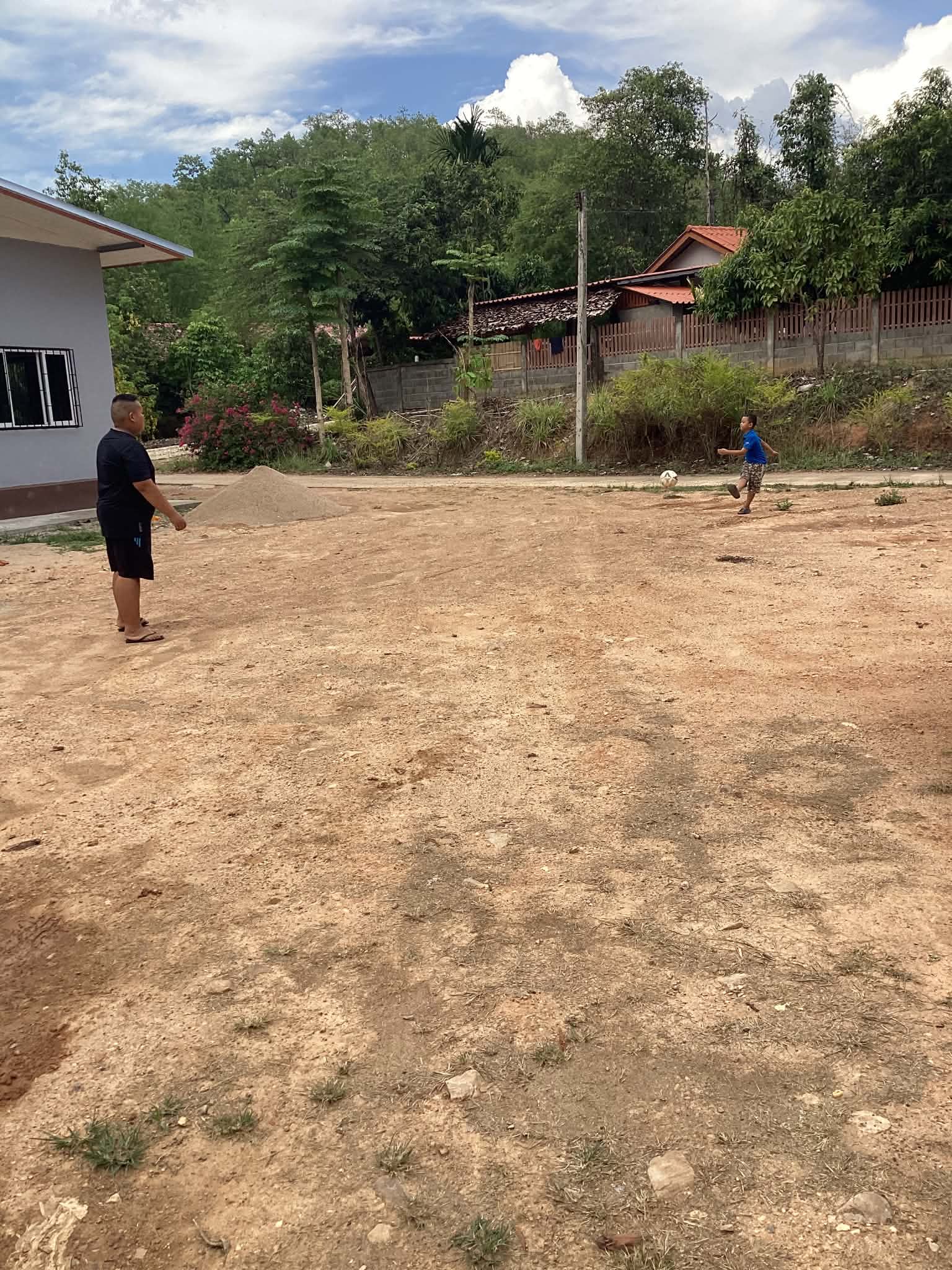 Non played football with his older brother.
