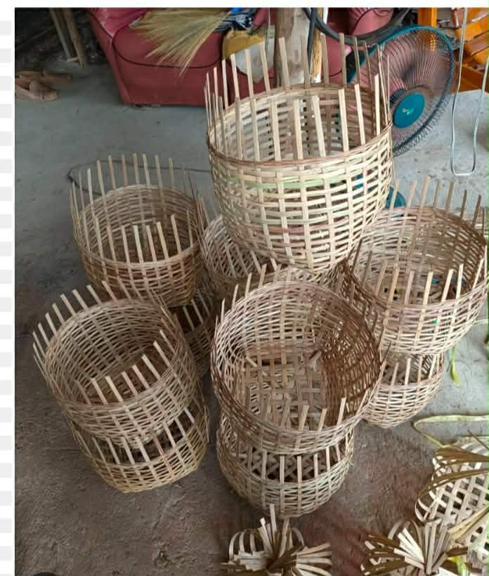 "Crafting in Progress: The intricate journey of bamboo weaving, where each unfinished basket tells a story waiting to be completed."
