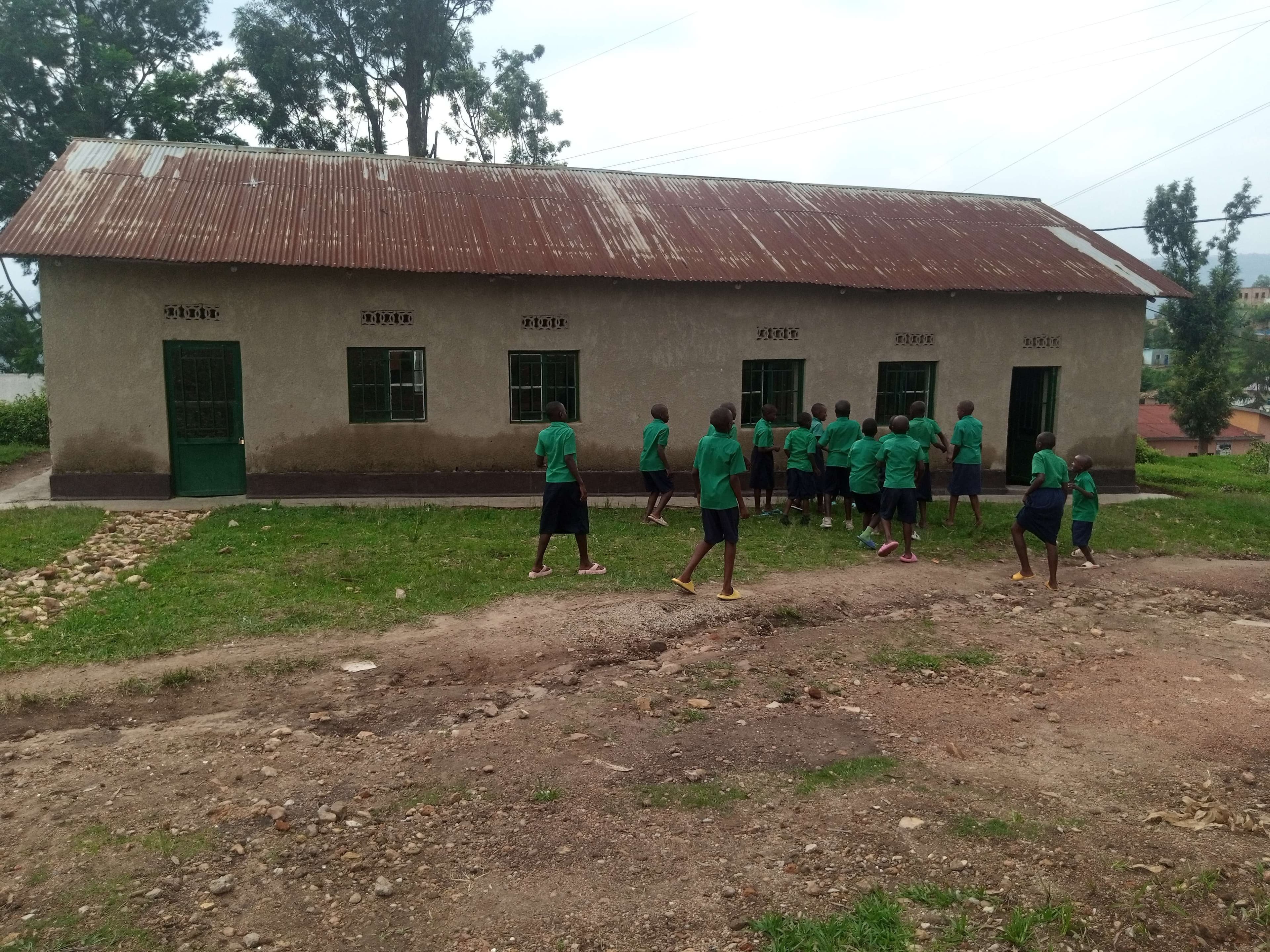 Children are playing in front of the classroom