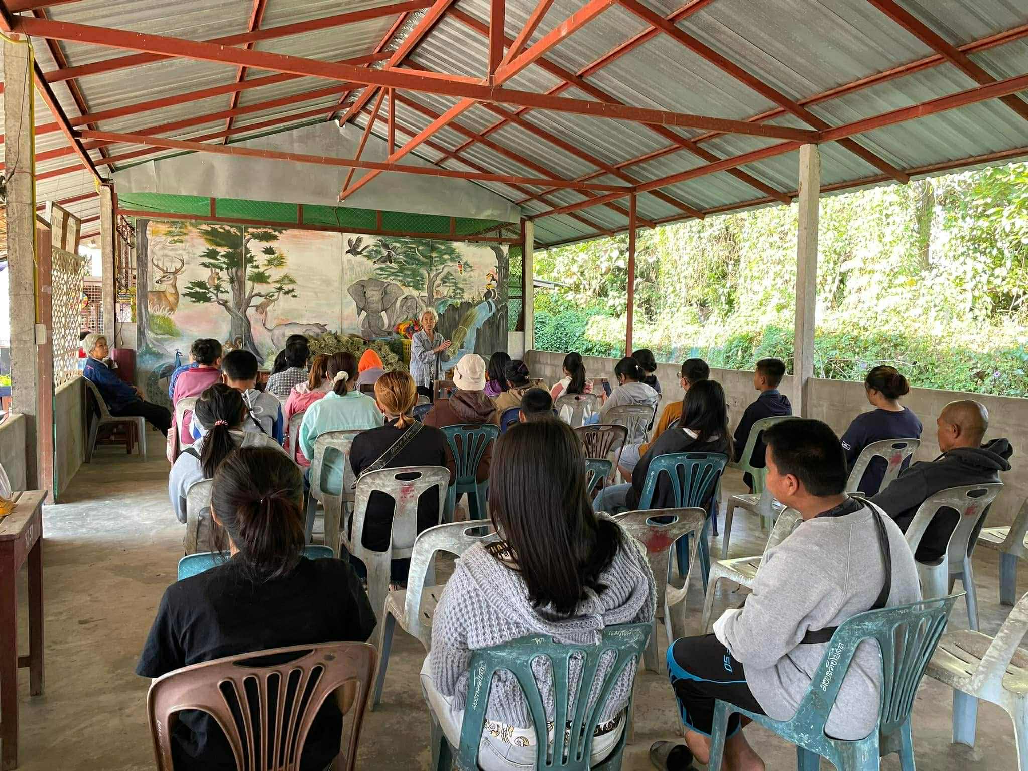 Hands-On Learning: The instructor leads a workshop on making broomsticks, engaging children and parents in a fun and informative crafting experience.