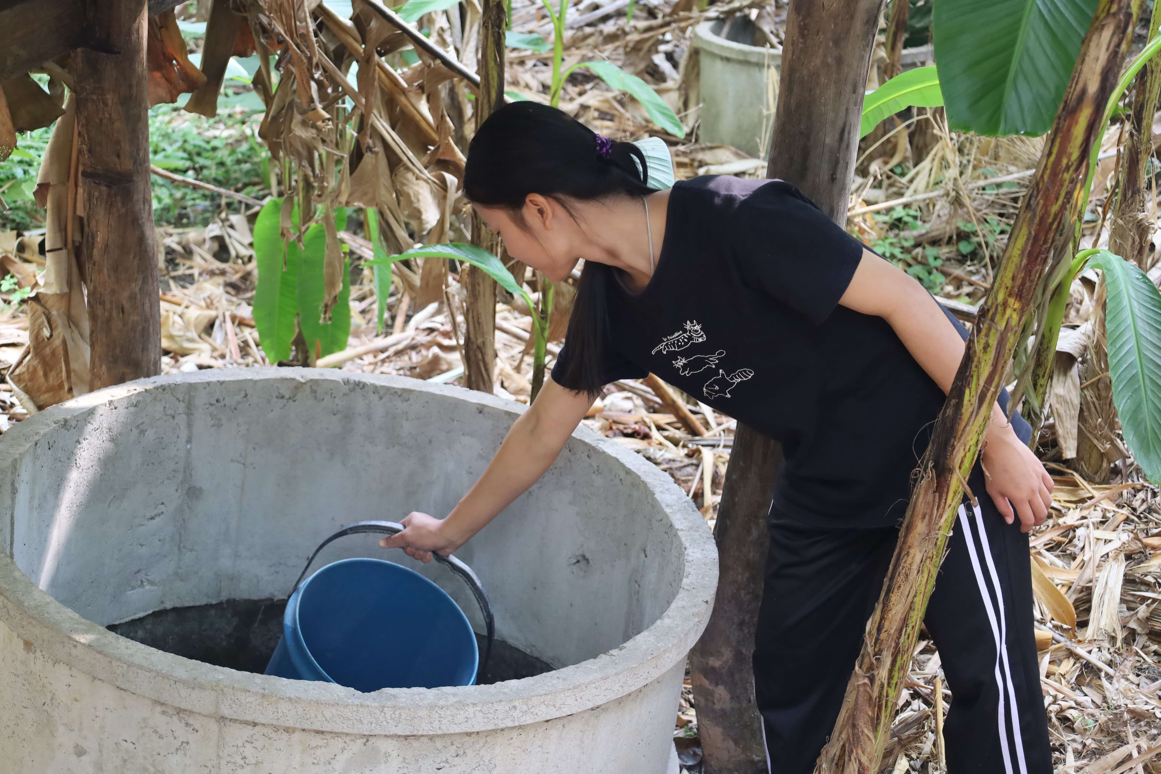 The children fetched water from the community well to drink.