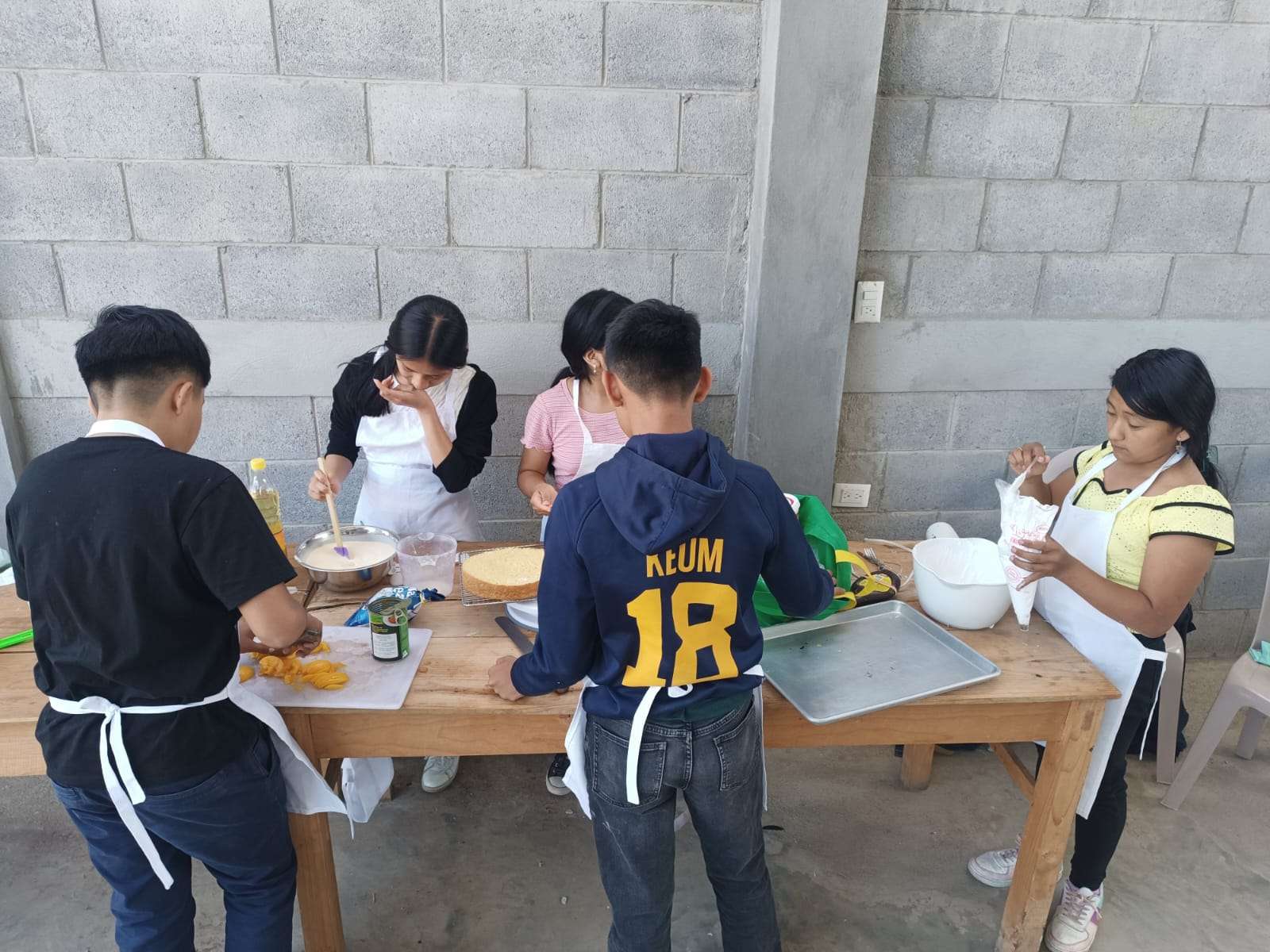 Participants cooking outdoors