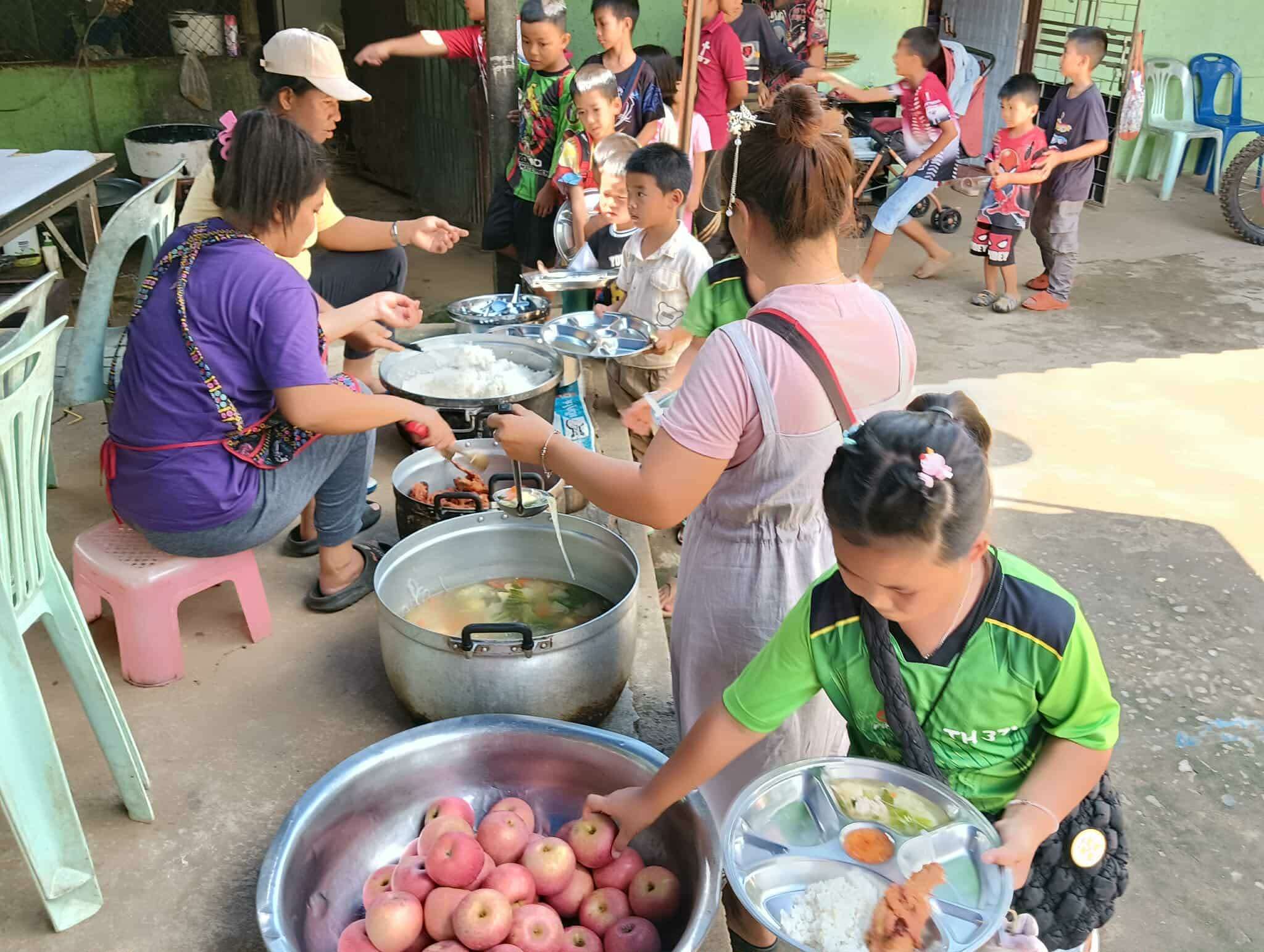 The cook served rice to the children in the project.