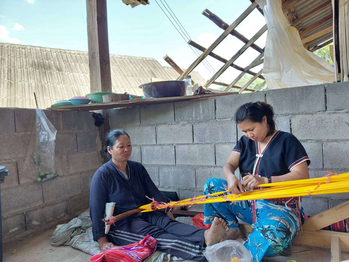 The process of dyeing the patterns on the sarong.