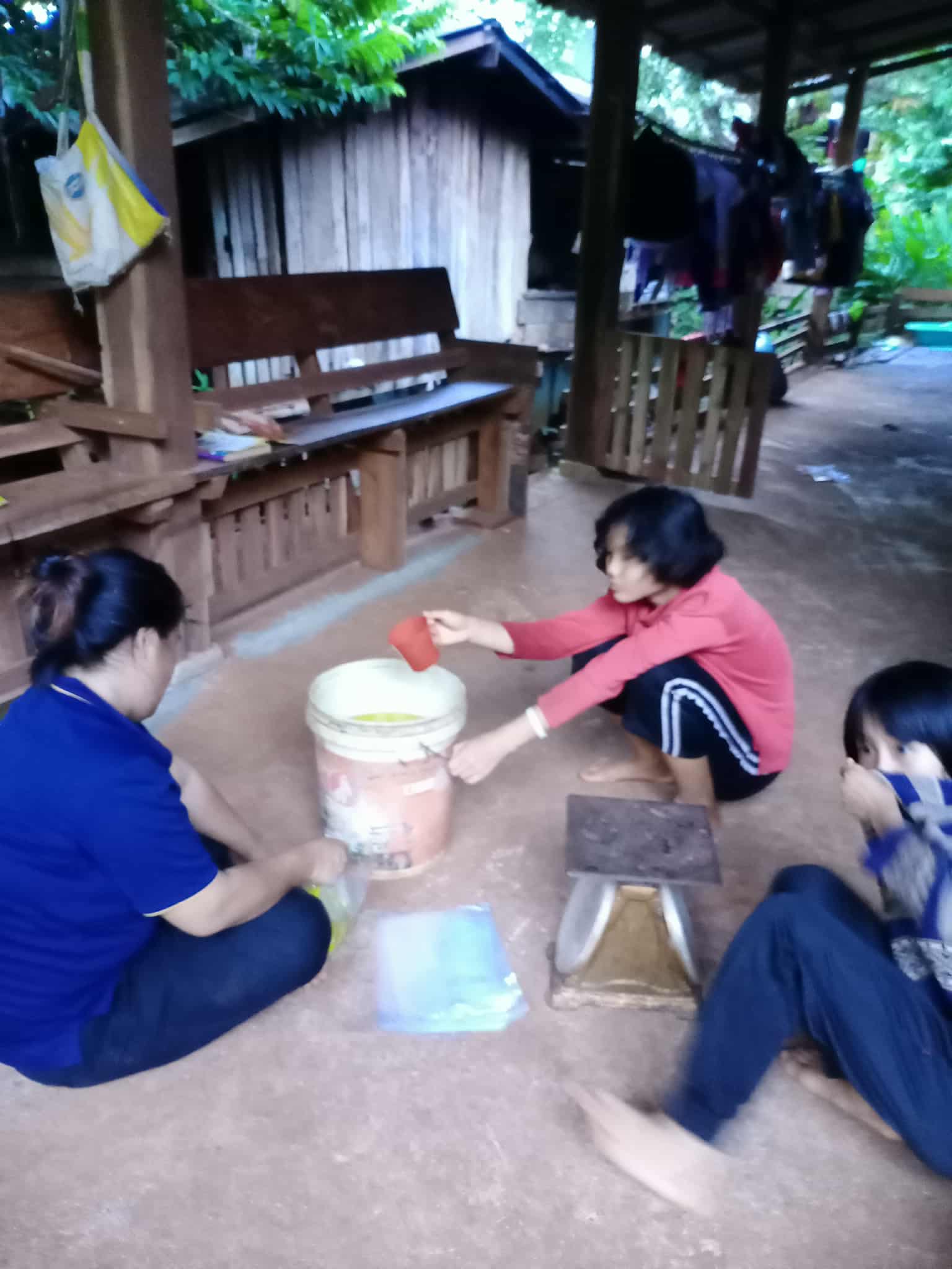 The children are waiting for the product to be packaged.