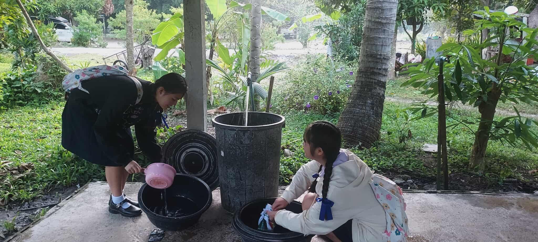 Every drop counts: Our children wash clothes and meet their daily needs, highlighting the importance of clean water in their lives.