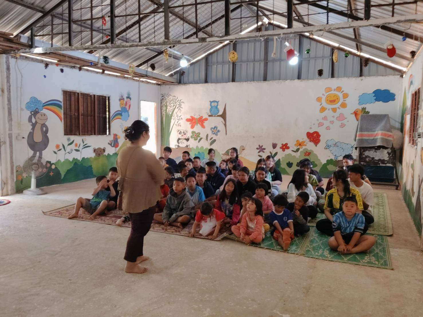 The Sunday school teacher teaches the children in the church.